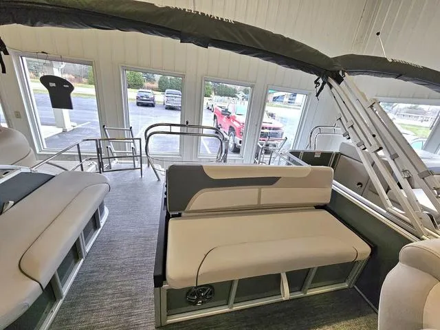 Slide: The Image of 2025 Godfrey Sweetwater 2286 SFL pontoon interior with seating and outdoor view. - 6