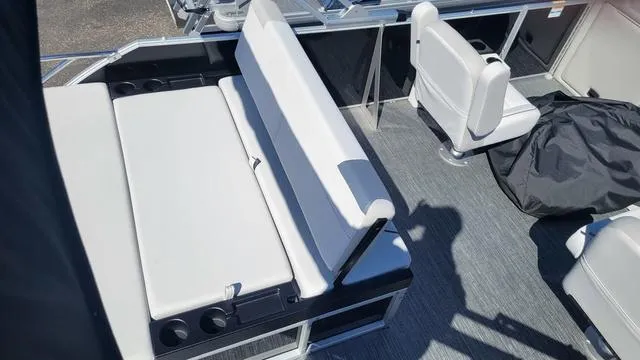 Slide: The Image of 2025 Godfrey Pontoons Sweetwater 2286 SFL interior with seating and cup holders. - 11