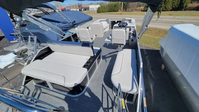 Slide: The Image of 2025 Godfrey Sweetwater 2286 SFL pontoon boat interior with spacious seating and modern design. - 5
