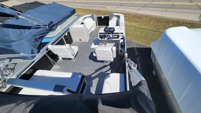 Slide: The Image of 2025 Godfrey Pontoons Sweetwater 2286 SFL GTP, spacious interior with modern seating and helm. - 6