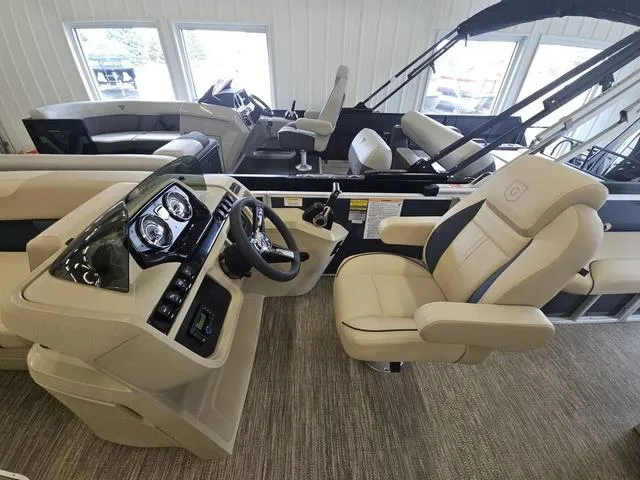 Slide: The Image of 2025 Godfrey Pontoons Sweetwater 2486 SFL GTP helm with luxurious seating and modern controls. - 4