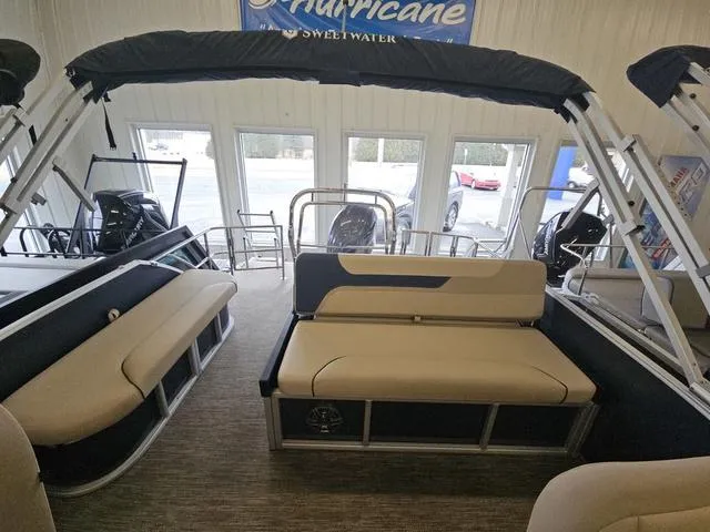 Slide: The Image of 2025 Godfrey Sweetwater 2486 SFL GTP pontoon interior with seating and canopy. - 5