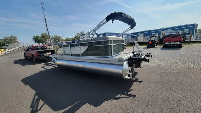 Slide: The Image of 2025 Godfrey Pontoons Xperience 1886 CX on trailer, parked outdoors on sunny day. - 11