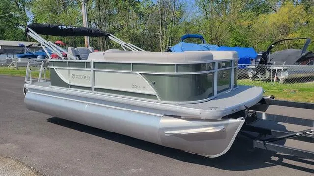 Slide: The Image of 2025 Godfrey Pontoons Xperience 1886 CX on trailer, parked outdoors. - 3