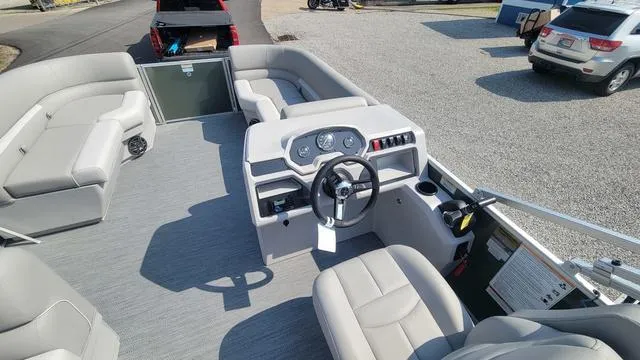 Slide: The Image of 2025 Godfrey Pontoons Xperience 1886 CX interior with steering console and seating. - 6