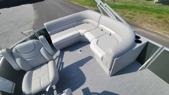 Slide: The Image of Luxurious seating on 2025 Godfrey Pontoons Xperience 1886 CX boat, featuring plush gray upholstery. - 8