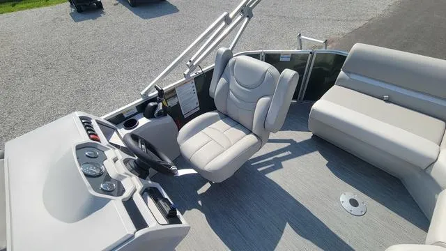 Slide: The Image of 2025 Godfrey Pontoons Xperience 1886 CX interior with helm and seating area. - 9