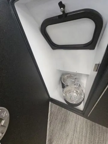 Slide: The Image of Interior storage compartment of 2025 Viaggio LAGO Z 22S 3T with containers. - 11