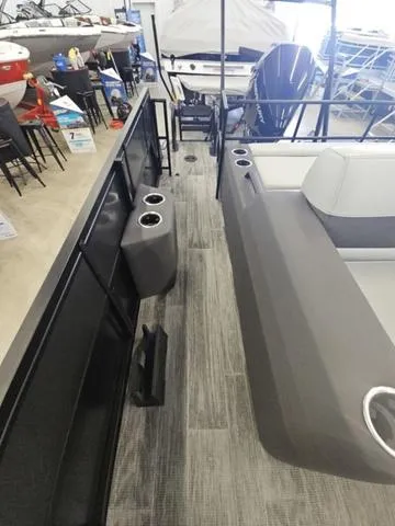 Slide: The Image of 2025 Viaggio LAGO Z 22S 3T boat interior with seating and cup holders. - 12