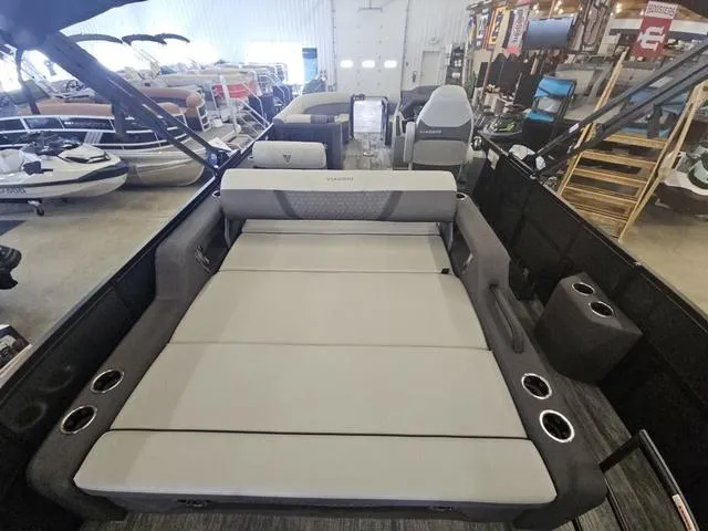 Slide: The Image of 2025 Viaggio LAGO Z 22S 3T pontoon boat interior with spacious seating and cup holders. - 14