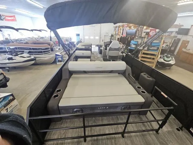 Slide: The Image of 2025 Viaggio LAGO Z 22S 3T pontoon boat with seating, displayed in a showroom. - 6