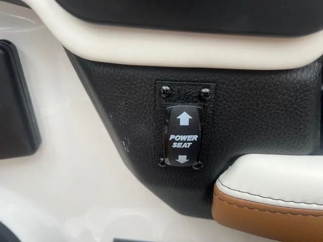 Slide: The Image of Power seat control in 2025 Malibu 23 MXZ boat interior. - 13