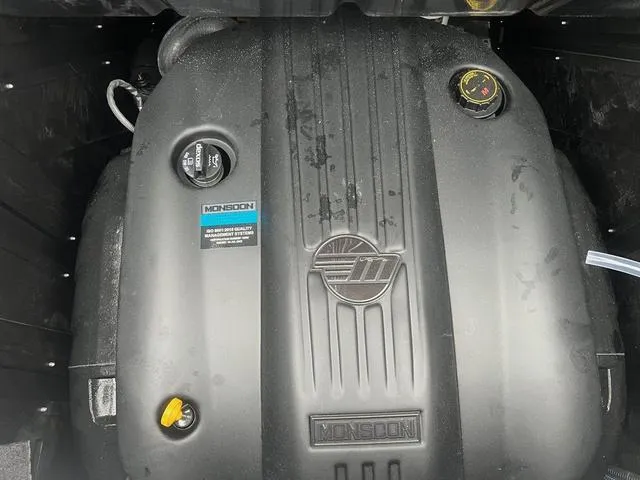 Slide: The Image of Engine of 2025 Malibu 23 MXZ boat, featuring Monsoon branding. - 17