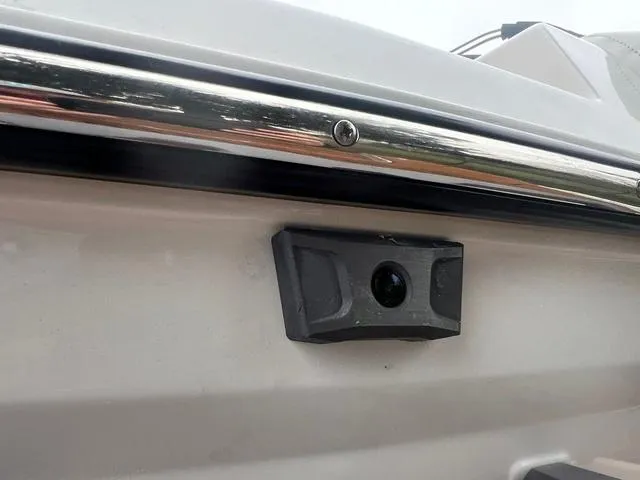Slide: The Image of 2025 Malibu 23 MXZ boat detail with mounted camera on the side. - 19