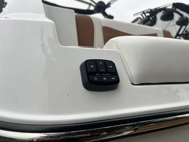 Slide: The Image of 2025 Malibu 23 MXZ boat interior with Wet Sounds audio control panel. - 20