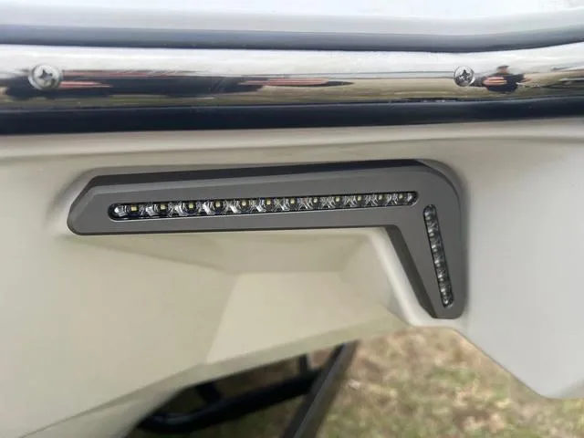 Slide: The Image of LED light detail on 2025 Malibu 23 MXZ boat exterior. - 24