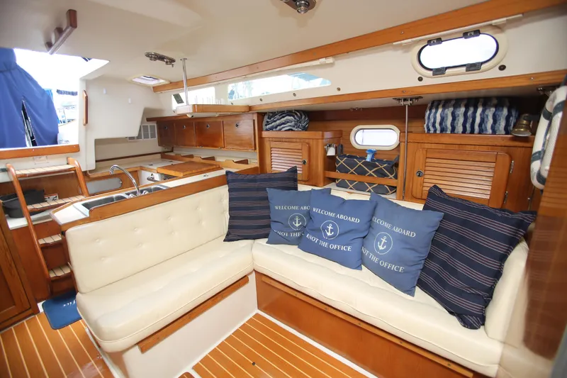Slide: The Image of Interior of 2002 Catalina 36 sailboat with cozy seating and nautical decor. - 7