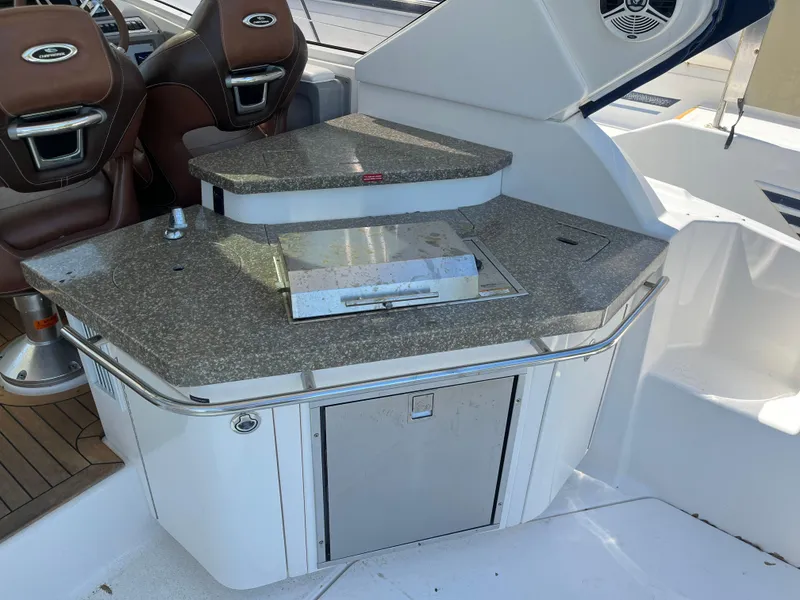 Slide: The Image of 2010 Chaparral 400 Premiere yacht interior with granite countertop and seating. - 13