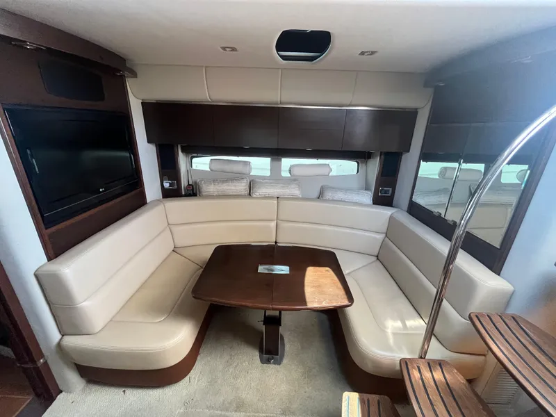 Slide: The Image of Luxurious interior of 2010 Chaparral 400 Premiere yacht with plush seating and elegant table. - 19