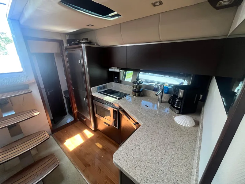Slide: The Image of Luxurious kitchen interior of 2010 Chaparral 400 Premiere yacht with modern appliances. - 20