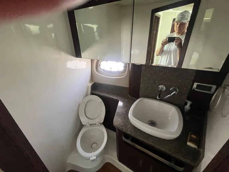 Slide: The Image of 2010 Chaparral 400 Premiere bathroom with sink, toilet, and mirror. - 24