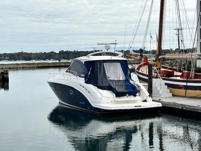 Slide: The Image of Chaparral 400 Premiere 2010 yacht docked at marina, calm water reflection. - 3