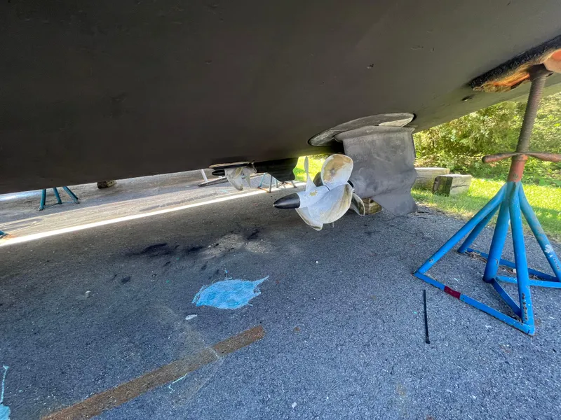 Slide: The Image of 2010 Chaparral 400 Premiere boat underside with propeller and supports. - 7