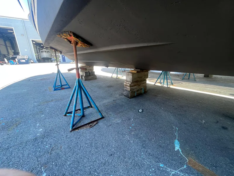 Slide: The Image of Chaparral 400 Premiere 2010 boat on stands in a shipyard for maintenance. - 8