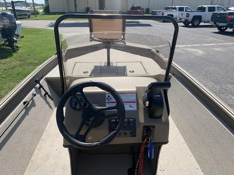 Slide: The Image of 2025 SeaArk Shadow 18 Center Console boat interior with steering wheel and controls. - 15