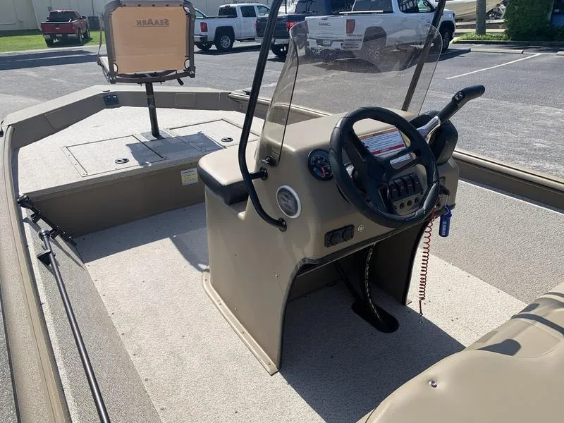 Slide: The Image of 2025 SeaArk Shadow 18 Center Console boat interior with steering wheel and seating. - 17