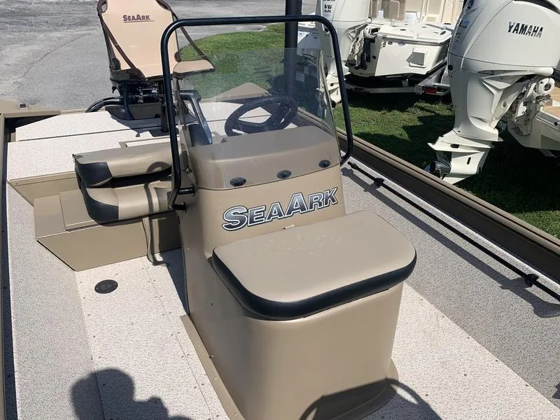 Slide: The Image of 2025 SeaArk Shadow 18 Center Console boat with steering wheel and seating. - 19