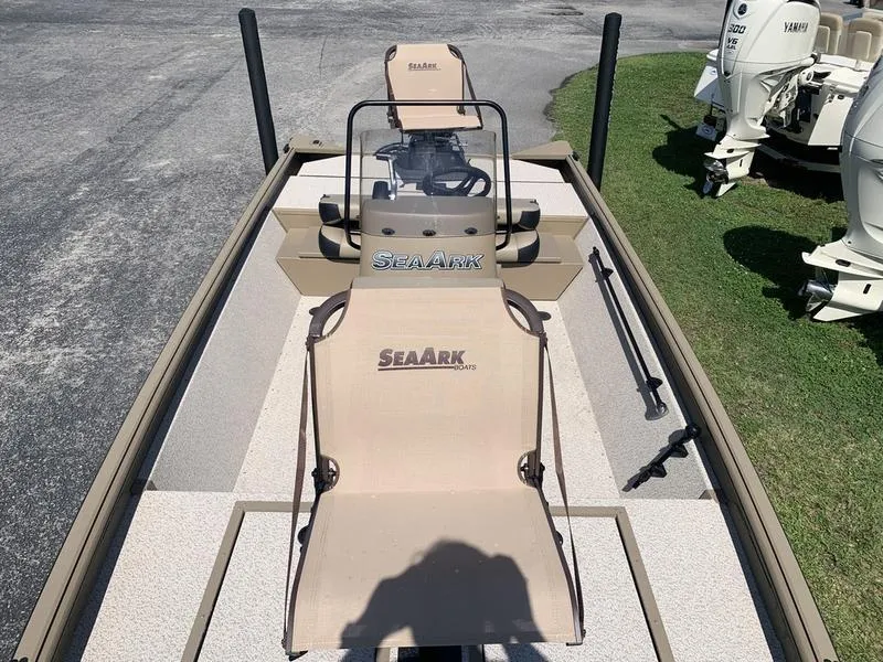 Slide: The Image of 2025 SeaArk Shadow 18 Center Console boat with seating and steering console. - 22