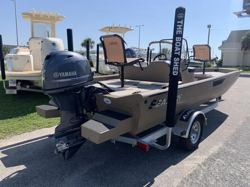 Slide: The Image of 2025 SeaArk Shadow 18 Center Console boat with Yamaha engine on trailer. - 4