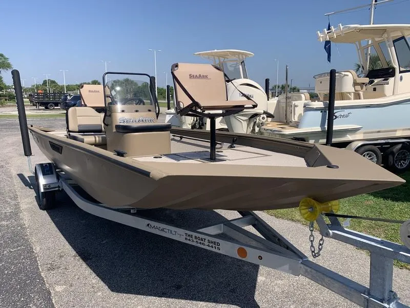 Slide: The Image of 2025 SeaArk Shadow 18 Center Console boat on trailer, parked outdoors. - 6