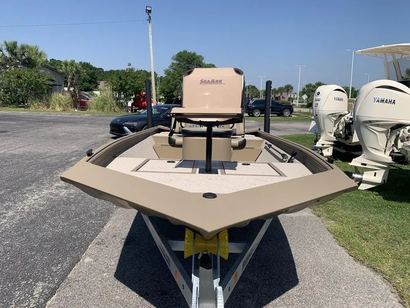 Slide: The Image of 2025 SeaArk Shadow 18 Center Console boat on trailer, parked outdoors. - 7