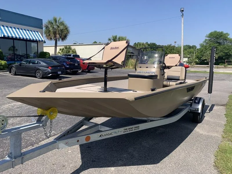 Slide: The Image of 2025 SeaArk Shadow 18 Center Console boat on trailer in parking lot. - 8