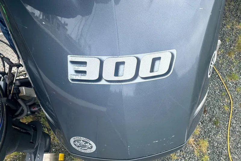 Slide: The Image of 2017 Hewescraft 240 Ocean Pro HT with 300 horsepower engine, parked on gravel. - 10