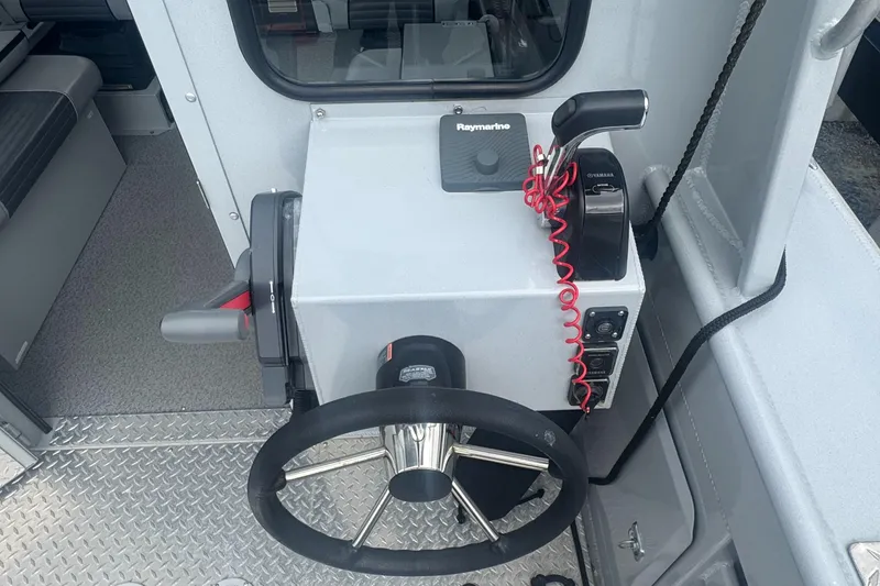 Slide: The Image of Steering console of 2017 Hewescraft 240 Ocean Pro HT boat with Raymarine equipment. - 17