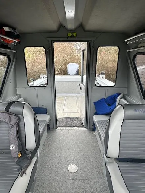 Slide: The Image of Interior of 2017 Hewescraft 240 Ocean Pro HT boat with seating and outdoor view. - 5