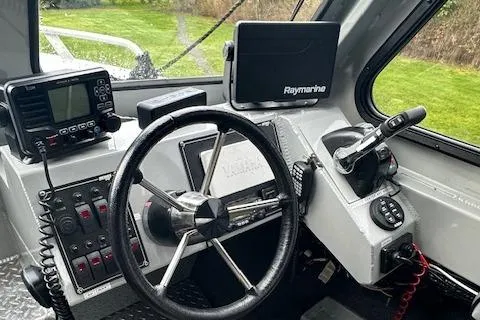 Slide: The Image of Helm of 2017 Hewescraft 240 Ocean Pro HT with navigation and control systems. - 8