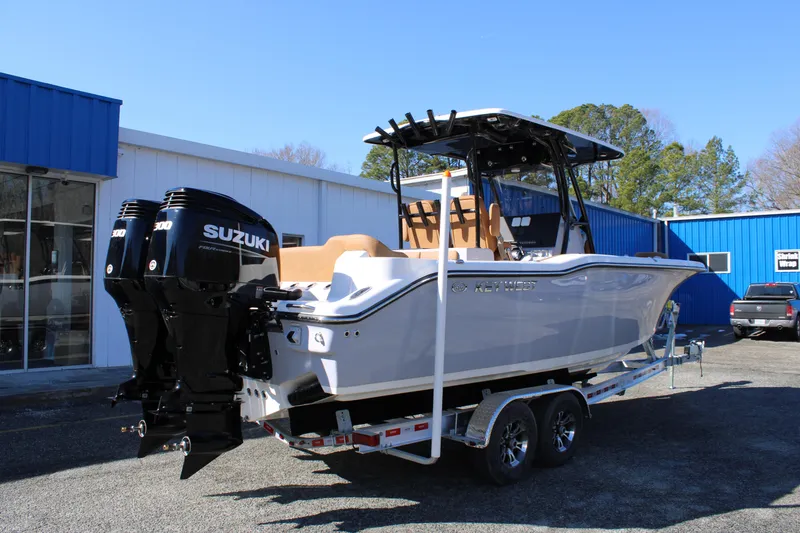 Slide: The Image of 2025 Key West 263 FS boat with dual Suzuki engines on a trailer. - 4