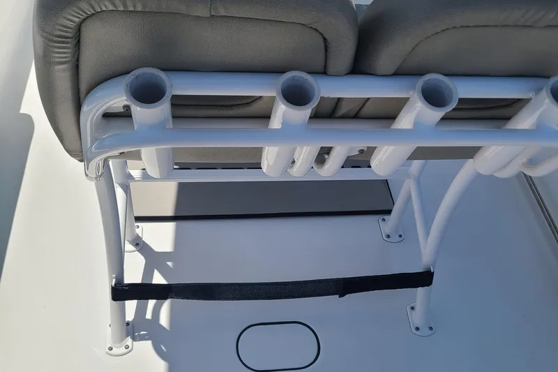 Slide: The Image of 2021 Sportsman Open 212 Center Console boat seating with rod holders. - 10
