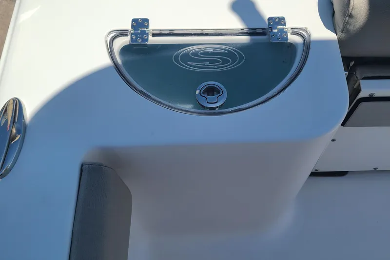 Slide: The Image of 2021 Sportsman Open 212 Center Console boat detail with storage compartment. - 11