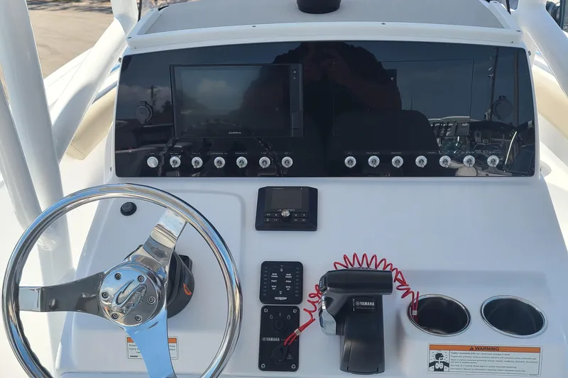 Slide: The Image of 2021 Sportsman Open 212 Center Console dashboard with steering wheel and controls. - 4