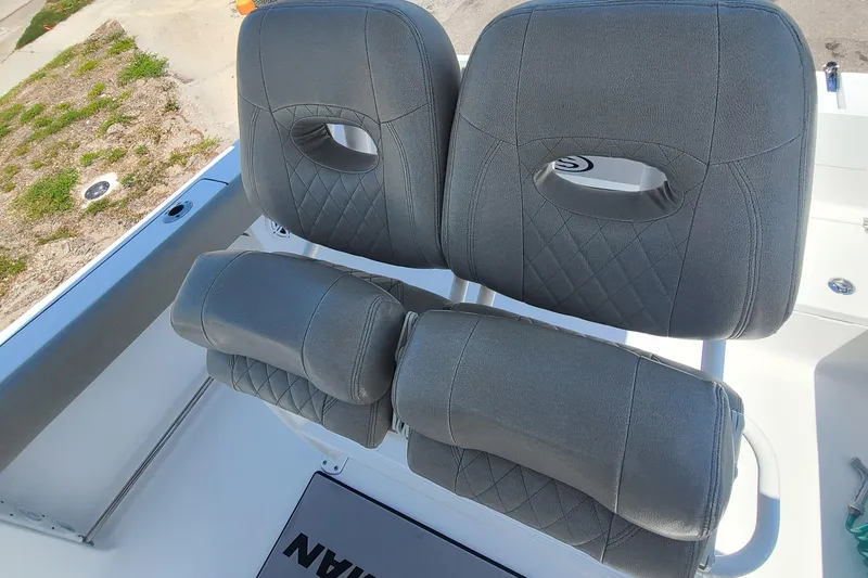 Slide: The Image of 2021 Sportsman Open 212 Center Console boat seats with gray upholstery. - 5