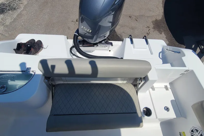 Slide: The Image of 2021 Sportsman Open 212 Center Console boat with Yamaha 150 engine and seating area. - 6