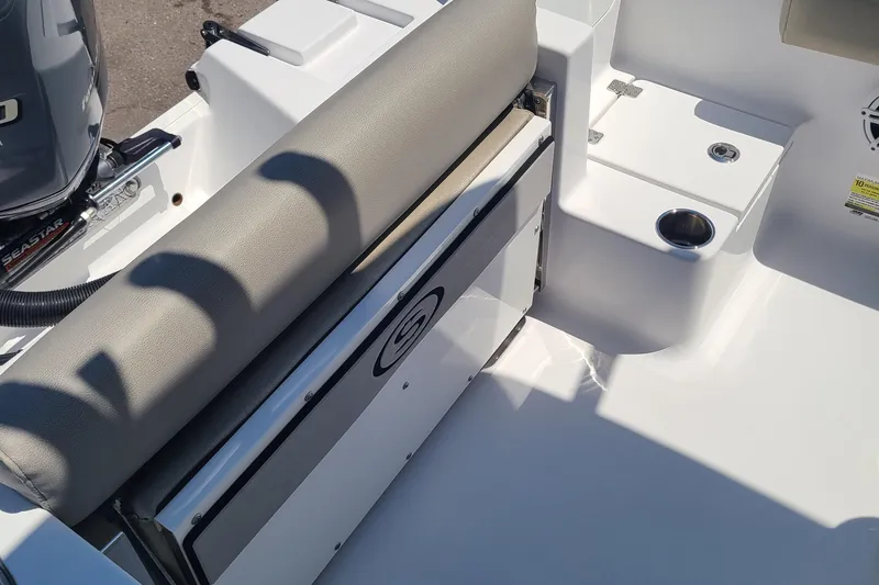 Slide: The Image of 2021 Sportsman Open 212 Center Console boat interior with seating and storage. - 7