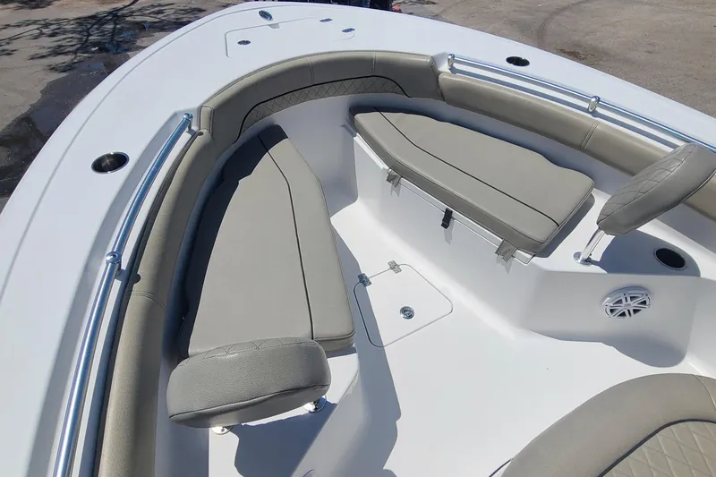 Slide: The Image of 2021 Sportsman Open 212 Center Console boat with cushioned seating and stainless steel railings. - 8