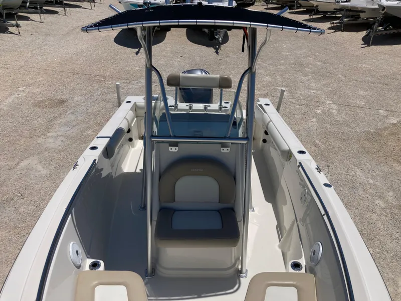 Slide: The Image of 2012 Sailfish 2180 boat with center console and seating, displayed on gravel lot. - 10