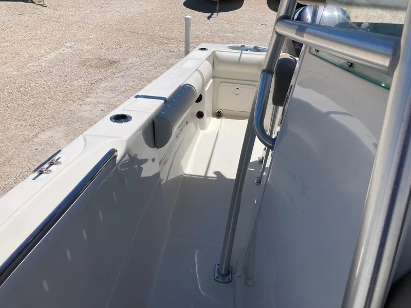 Slide: The Image of 2012 Sailfish 2180 boat interior, featuring clean deck and stainless steel railing. - 11